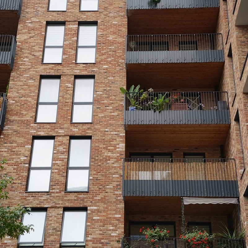 Urban commercial development using red multi brick for aesthetic appeal.