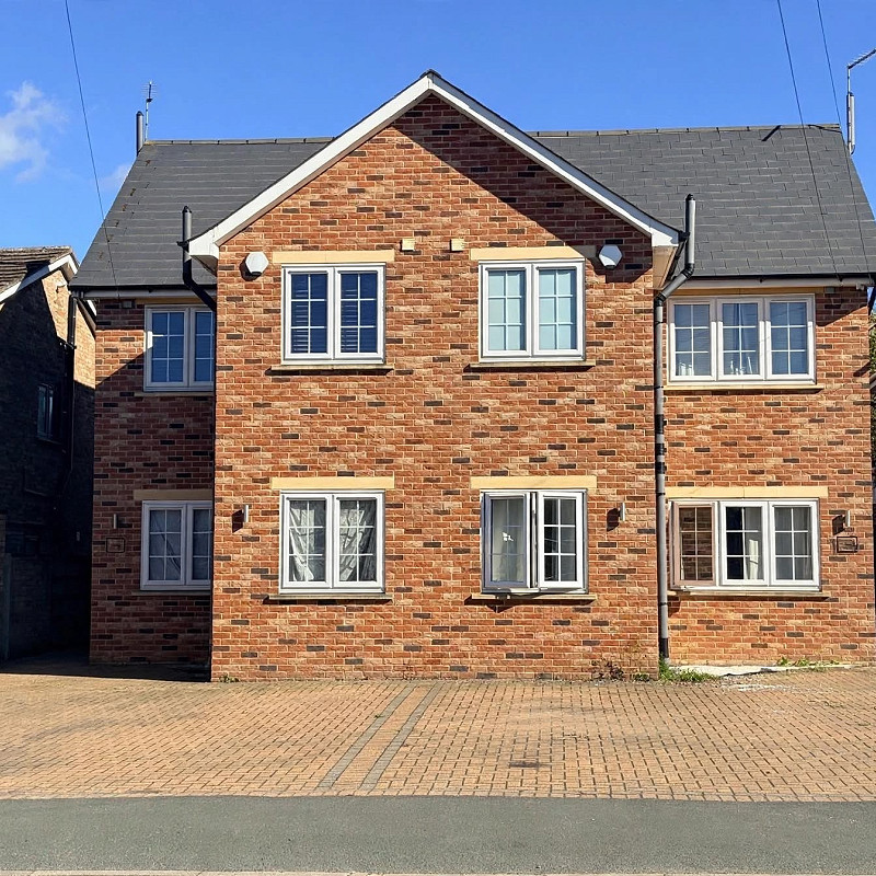 House constructed in the Audley Antique brick with cast stone heads and cills