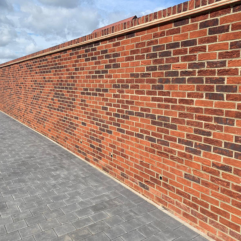 red multi brick wall.