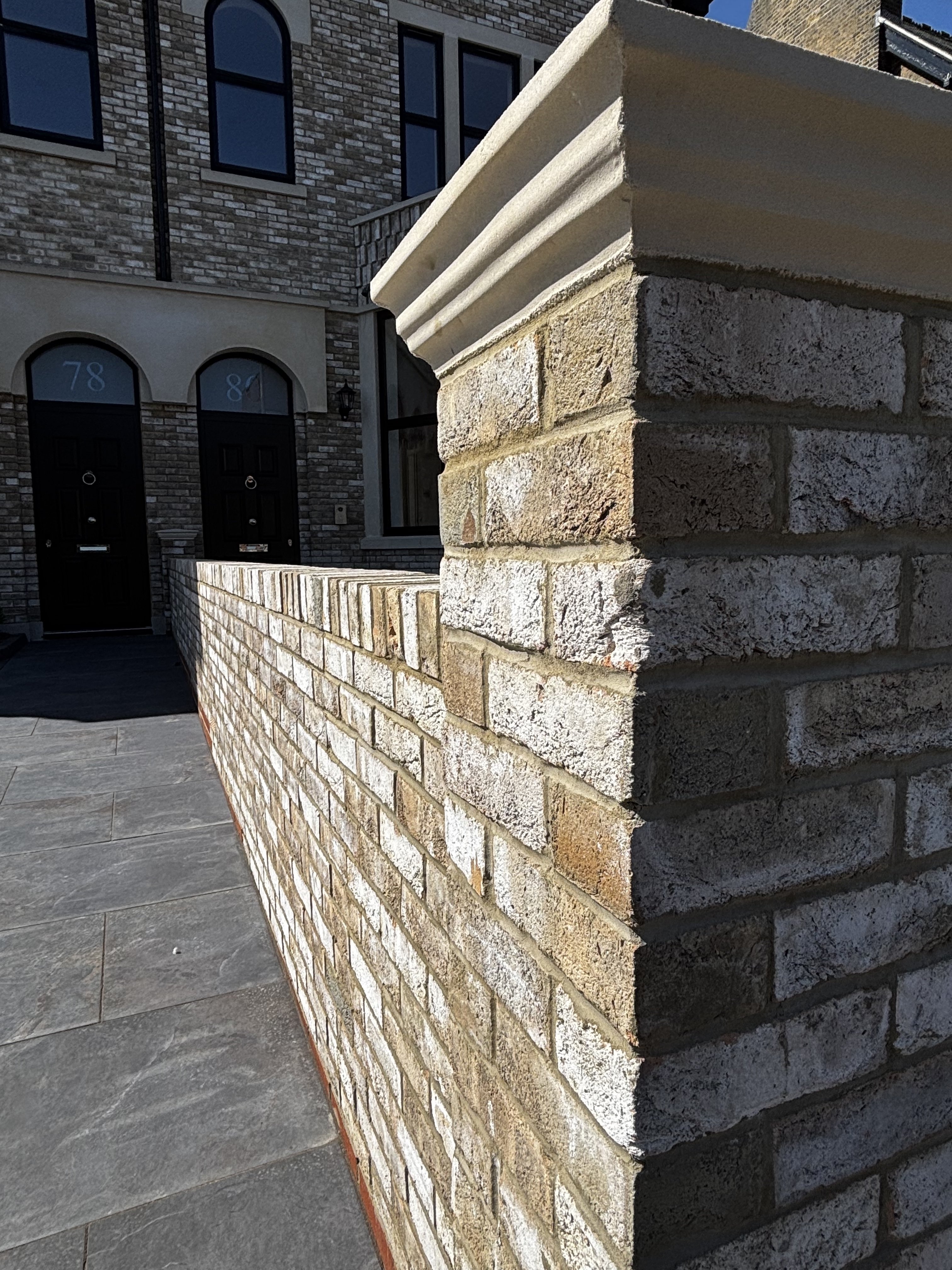 Mystique brick with a cast stone pier cap.