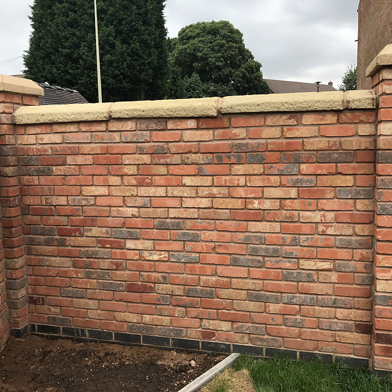 brick wall constructed from a tumbled brick.