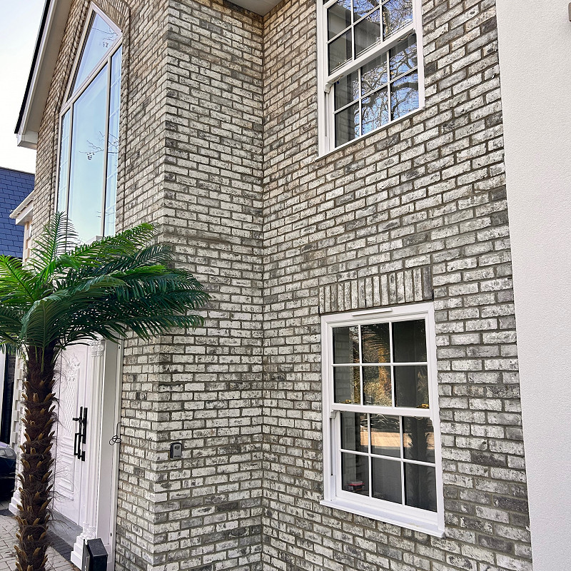 New build house featuring a grey multi brick.