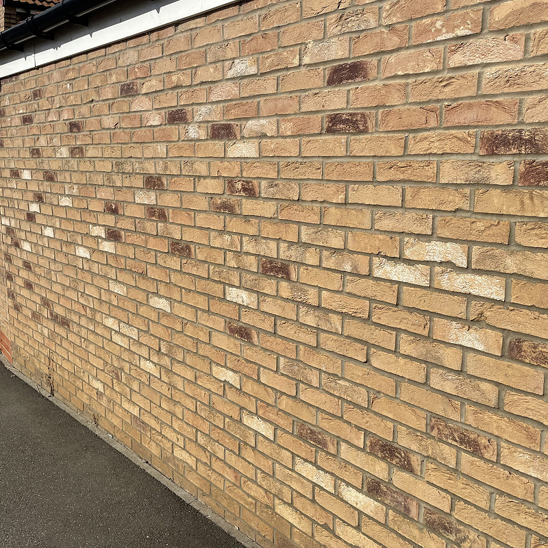 Close up of a project showcasing the Kingshall Cream Mixture Brick.