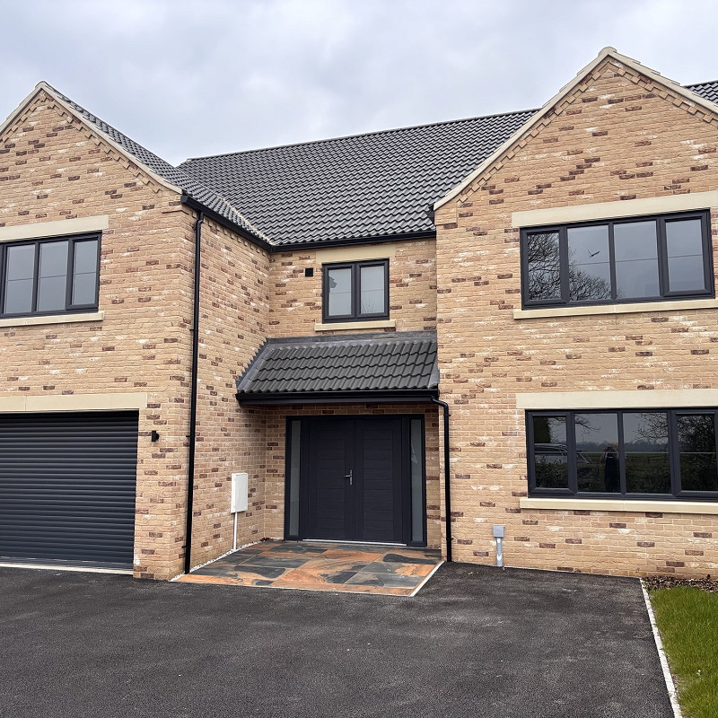 Close up of a project showcasing the Kingshall Cream Mixture Brick.