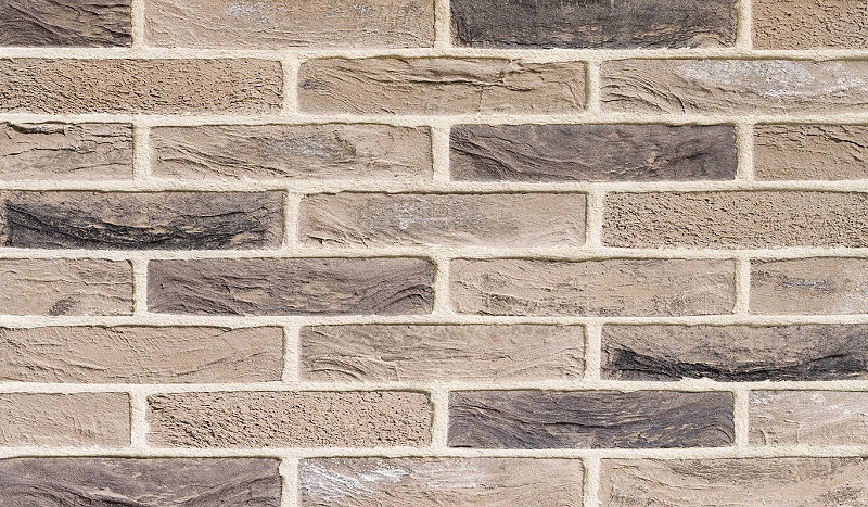 Close up texture of a grey linear brick