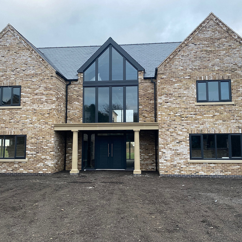 Self-Build house constructed in a buff brick.