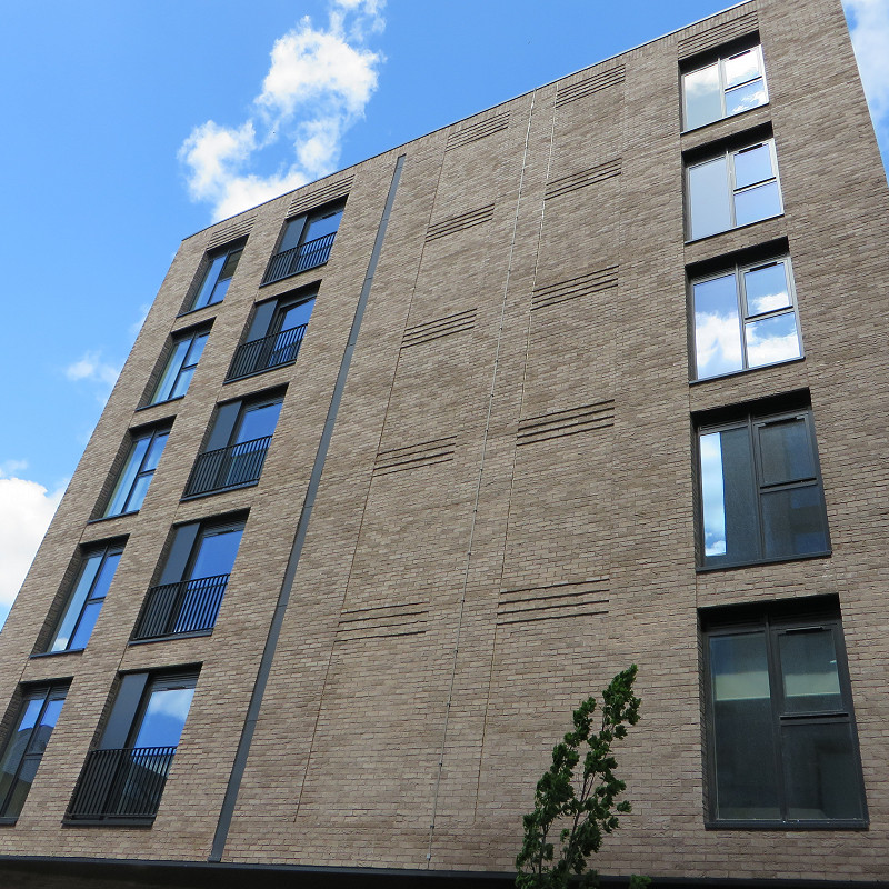 building with a grey brick facade