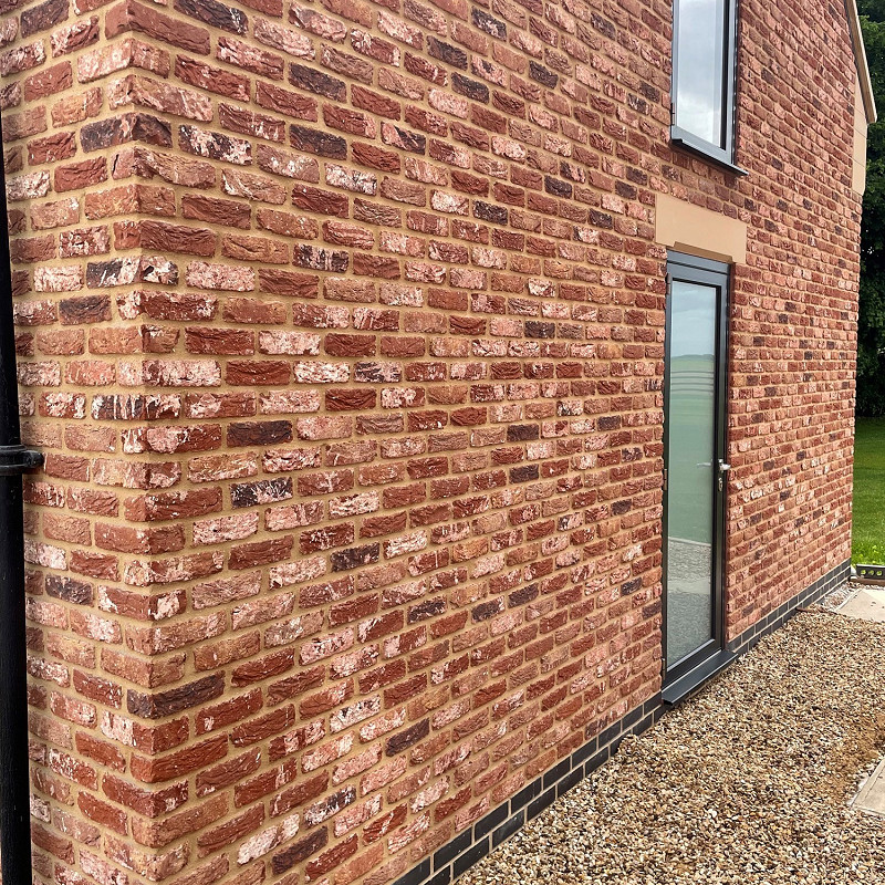 Closeup of rustic tumbled brickwork.