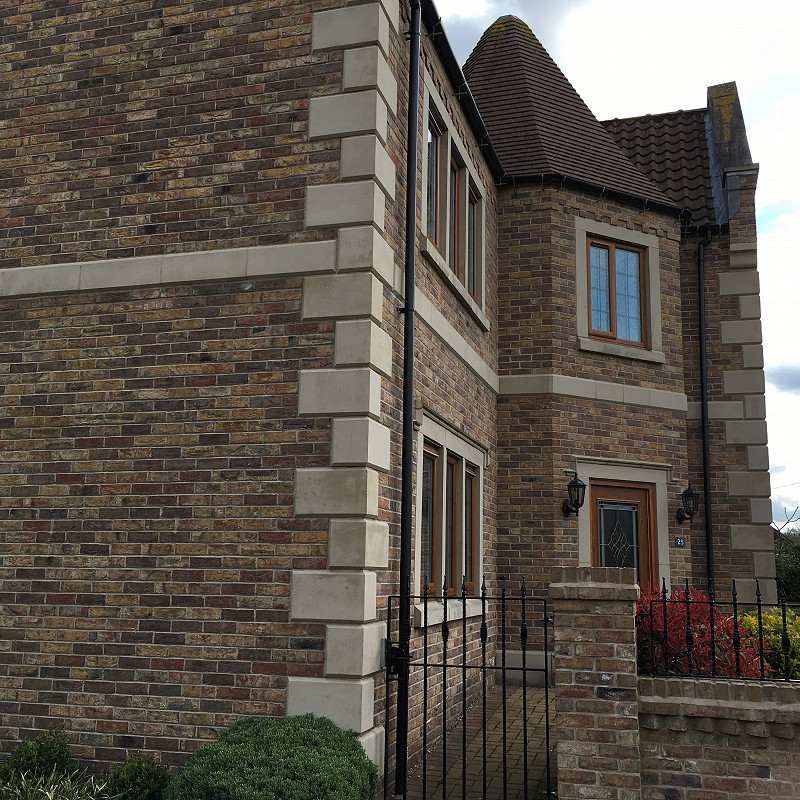 york red multi bricks with cast stone quoins.